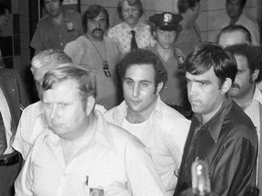 FILE - In this Aug. 11, 1977 file photo, serial killer David Berkowitz, known as &ampquot;Son of Sam,&ampquot; arrives at Brooklyn Courthouse in New York. A new documentary on the Smithsonian Channel paints a portrait of the fearful, dysfunctional New York City before Berkowitz was captured. (AP Photo/Ira Schwarz, File)