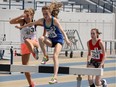 Athletes Emma Everett, left, Emily Bryce and Marisha Thompson, right, in the 1,500-metre steeplechase event during The Royal Canadian Legion, Ontario Command Summer Track and Field Championship held at University of Windsor Stadium's Alumni Field (NICK BRANCACCIO/Windsor Star)