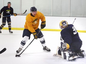 New Windsor Lancers forward Ryan Taylor shows his patience against goaltender Paolo Battisti during Gold and Blue scrimmage at Central Park Athletics Friday.  Taylor picked up the puck on a defensive giveaway and scored on the play. (NICK BRANCACCIO/Windsor Star)