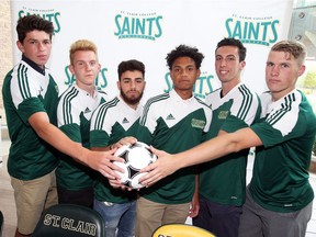 St. Clair College Saints men's soccer team recruits Michael Roncone, left, Braeden Vaile, Hassan Zaitoun, Sergei Ouditt, Christopher Spadafora and Joshua Hunter, right, during a signing press conference held at the SportsPlex on Wednesday.