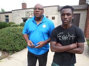 John Elliott, left, chats with Moses Barutwanayo, 15, during a mentoring program at STAG, Sandwich Teen Action Group July 26, 2017.