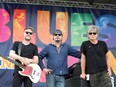 Stuart Chatwood, Jeff Martin and Jeff Burrows from The Tea Party take a break July 13, 2017, during warm-up ahead of their headline performance at the 2017 LiUNA! Bluesfest Windsor.