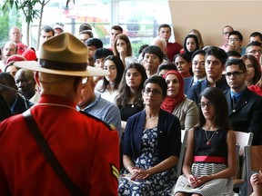 New Canadians are sworn in during a Canada Day citizenship ceremony at Adventure Bay on July 1, 2017.