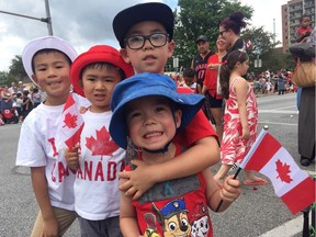 Members of the Lo and Lei families show off their maple leafs at the Canada Day Parade on July 1, 2017 — marking Canada's 150th birthday.