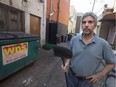 Ron Balla, owner of the Coffee Exchange, is pictured broom in hand outside his business, Thursday, July 27, 2017.  Balla believes business owners as well as the city should do more to maintain their businesses, in the front and the back.