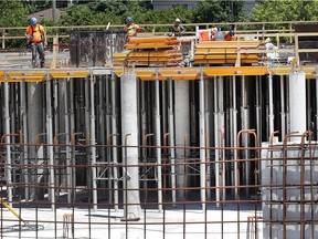 Crews work Tuesday at the construction site of Enwin's $25-million water reservoir project. The project involves building and connecting a new 35-million-litre underground tank to the A.H. Weeks water treatment plant at Wyandotte Treet East and George Avenue.