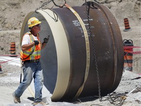 Crews work Tuesday at the construction site of Enwin's $25-million water reservoir project. The project involves building and connecting a new 35-million-litre underground tank to the A.H. Weeks water treatment plant at Wyandotte Street East and George Avenue.