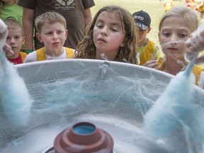 Kids wait in line for cotton candy at the Essex Civic Centre, July 21, 2017, as the County of Essex hosted a community celebration in honour of its 225th birthday, as well as Canada's 150th.