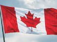 A huge Canadian flies above Windsor's riverfront on June 30, 2017.