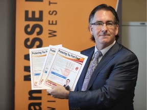 MP Brian Masse unveils the new national fraud protection campaign at his constituency office on Ouellette Avenue in Windsor, Ontario on July 27, 2017.