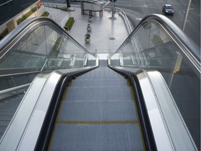 Looking down a tall escalator. Photo by Getty Images.