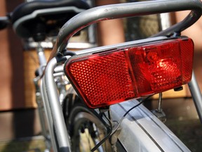 Bicycle red back light close-up. Photo by Getty Images.