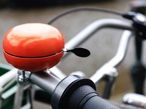 Bright orange bicycle bell. Photo by Getty Images.