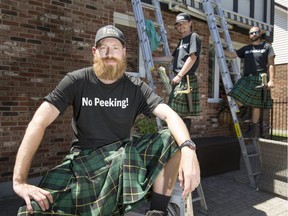 Ben Snow, left, owner of the Windsor franchise of Men in Kilts Window Cleaning Service, is joined by employees Noah Huggard and Curtis Lock to work on a home in East Windsor on July 4, 2017.