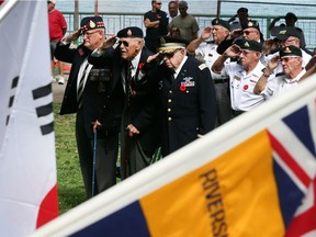 Retired  Lieut. Col. Morris Brause of the Essex and Kent Scottish, left, Bill Moss, a Korean War veteran of the U.S. Artillery 64th Field Regiment, and retired  Lieut. Col. Sol Baltimore, a Korean War Veteran with the U.S. Infantry Officer 25th Infantry Division, stand during the memorial service July 27, 2017 to recognize the 64th anniversary of the ceasefire at the end of the Korean War.