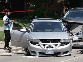 The westbound lanes of Wyandotte Street East were shut down for more than an hour on Monday, July 17, 2017, due to a two-vehicle collision at the intersection of Belle Isle View Boulevard. The accident occurred shortly after 2 p.m. and injuries were minor. A concrete hydro pole was snapped which required the assistance of Enwin Utilities workers. One of the motorist involved removes items from his car.