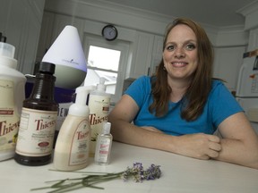 Stephanie Pouget displays an assortment of essential oils recently at her home in Wheatley.