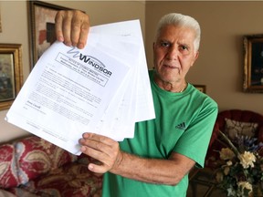 Marcello Rose, who lives on McKay Avenue in Windsor, with a petition, July 14, 2017, against a prayer day parking proposal that has upset neighbours living near the Windsor Mosque.