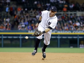 Detroit Tigers second baseman Ian Kinsler scoops the ball to first base for an out against Kansas City Royals' Jorge Bonifacio in the eighth inning of a baseball game in Detroit on July 24, 2017.