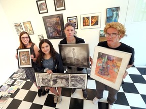 Sandwich Secondary School students from left, Emma Litschko,  Ashley Kerr, Spencer Ginn, and David Scott during preparations for their art show at  MacKenzie Hall in Windsor, Ontario on July 19, 2017.