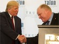(File photo). Donald Trump (left) shakes hands with Toronto mayor Rob Ford (right) during the  grand opening ribbon cutting ceremony at Trump International Hotel and Tower in Toronto, Ontario, Monday, April 16, 2012.   (Tyler Anderson/National Post)