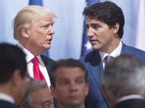 Prime Minister Justin Trudeau, right, and U.S. President Donald Trump chat at the G20 summit in Germany on July 8, 2017.