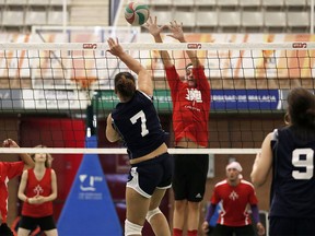 Canada's Kaidyn Blair, in red, goes to block a kill attempt during a volleyball match at the World Transplant Games in Spain recently.