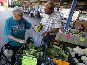 Tyson Koehn of Kingsville sells produce at a farmer's market in downtown Windsor in this 2009 file photo.
