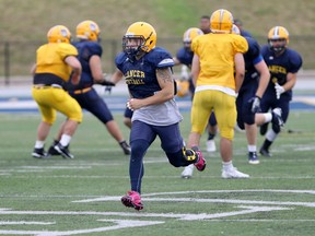 Back from an ACL injury that cost him the 2016 season, Windsor Lancers linebacker Matt Gayer, centre, is hoping to help his team reach the OUA football playoffs for the first time since 2014.(NICK BRANCACCIO/Windsor Star)