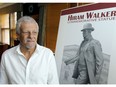 Local sculpture artist Mark Williams with poster of Hiram Walker at a press conference, Aug. 11, 2017, announcing details and sponsors for a statue project honouring the whiskey magnate.