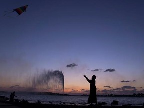 FILE- In this Monday, Feb. 20, 2017 file photo, a boy flies a kite on the Red Sea beach near the landmark Jiddah fountain, in Jiddah, Saudi Arabia. Saudi Arabia is planning to build a semi-autonomous luxury travel destination along its Red Sea coast that visitors can reach without a visa. The Red Sea area, which will include diving attractions and a nature reserve, will be developed with seed capital from the country&#039;s Public Investment Fund. (AP Photo/Amr Nabil, File)