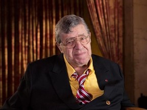 FILE - In this April 12, 2014, file photo, actor and comedian Jerry Lewis poses during an interview at TCL Chinese Theatre in Los Angeles. Lewis, the comedian and director whose fundraising telethons became as famous as his hit movies, has died. Publicist Candi Cazau said Lewis passed away Sunday, Aug. 20, 2017, at age 91 in Las Vegas with his family by his side. (Photo by Dan Steinberg/Invision/AP Images, File)