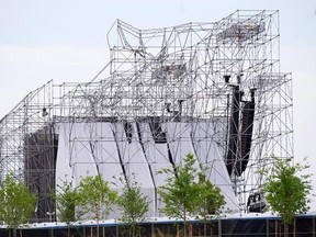 A collapsed stage is shown at a Radiohead concert at Downsview Park in Toronto on June 16, 2012. Lawyers for an entertainment company and an engineer accused in a deadly 2012 stage collapse at an outdoor Radiohead concert in Toronto are asking an Ontario court to stay the charges against them. The entertainment company Live Nation and an engineer, Domenic Cugliari, are arguing the case has seen unreasonable delays that violate their right to a timely trial. THE CANADIAN PRESS/Nathan Denette