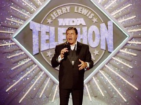 Jerry Lewis makes his opening remarks at the 25th Anniversary of the Jerry Lewis MDA Labor Day Telethon fundraiser in Los Angeles on Sept. 2, 1990. The passionate advocacy work of Jerry Lewis has left an indelible mark in Canada, says the head of Muscular Dystrophy Canada. THE CANADIAN PRESS/AP, HO, Julie Markes