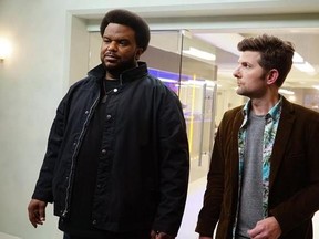 This image released by Fox shows Craig Robinson, left, and Adam Scott in a scene from &ampquot;Ghosted,&ampquot; premiering Oct. 1 on Fox. (Kevin Estrada/Fox via AP)