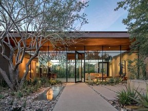 This photo provided by Weddle Gilmore black rock studio shows the entry courtyard of a residence located in Paradise Valley, Ariz. (Bill Timmerman/Weddle Gilmore via AP)