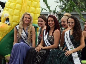 Nibby was joined by local beauties Tina Benotto, left, Alysha Rosaasen, Jillian Parent, Katelyn Samson, Agnesa Kelmendi and Chastine Lamoureux, right, during Tecumseh Corn Festival parade in this file photo from Saturday August 23, 2014.