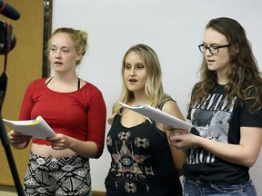 Revolution Youth Theatre members Lily Thibert, 17, left, Yasmine Sole, 18, and Teagan Smallhorn, 18, perform during a rehearsal at WFCU branch on Lauzon Road on July 27, 2017. The local organizations is putting together a play dealing with sensitive issues that face our teens today.