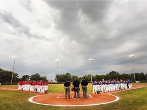 Team Ontario, left, and Team Quebec line up before the start of their game at the Baseball Canada Women's Invitational Championship at Mic Mac Park in Windsor, ON. on Thursday, August 3, 2017.