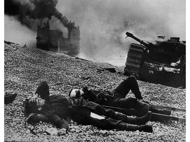 George Brown of Leamington fought at Dieppe, was captured, escaped, swam into channel and rescued. Shown is a photo of Brown, foreground, seen injured on the beach at Dieppe.