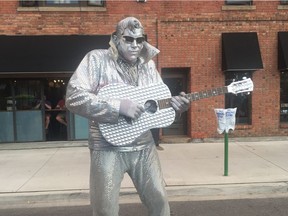 Silver Elvis entertains crowds with his oddly mesmerizing moves at Walkerville Buskerfest on Friday, Aug. 11, 2017.