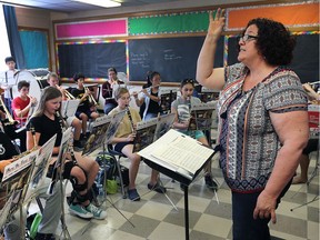 Bernadette Berthelotte, director of a youth summer band camp, leads students on Friday, Aug. 18, 2017, at the David Maxwell Public School in Windsor.