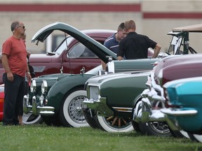 Visitors at the Festival of Cars Show look over a row of classic cars at the Transportation Museum and Heritage Village in Essex in this 2014 file photo.