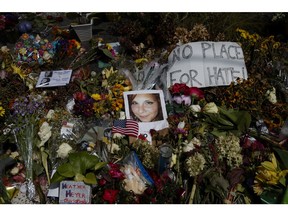 A photo of Heather Heyer, who was killed during a white nationalist rally, sits on the ground at a memorial the day her life was celebrated at the Paramount Theater, Wednesday, Aug. 16, 2017, in Charlottesville, Va.