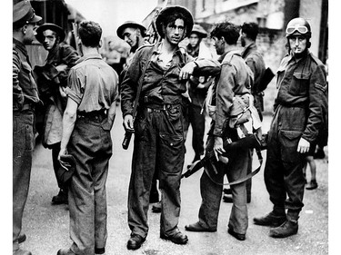 In this first picture of commandos after their daring nine hour raid on Dieppe France. Canadian troops are pictured returning to their camp somewhere in England.