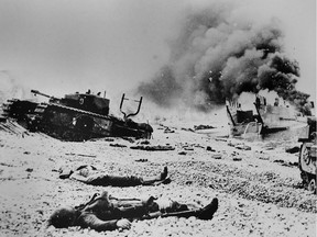 The bodies of two soldiers are shown on the cobblestone beaches of Dieppe, France following the ill-fated Allied raid on Aug. 19, 1942.