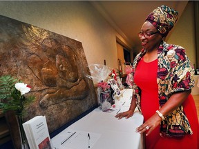 The Amherstburg Freedom Museum hosted an Emancipation Celebration at the Caboto Club, Aug. 4, 2017. The annual event recognizes the abolition of slavery in Canada in 1834. Here, Joanne Fuller checks out artwork featured in a silent auction.