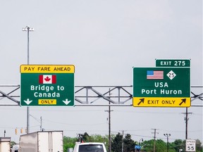 Canada-U.S. border highway direction sign. Photo by Getty Images.
