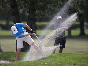 Jordan Crampton, who finished in a tied for fifth places,  pitches out of the sand on the 5th hole during the final round of the Western Ontario Men's Amateur Golf Championship at Beach Grove Golf and Country Club on Sunday. Dax Melmer, Windsor Star