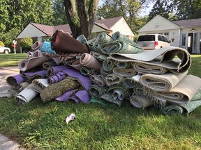 Rolls of carpet sit in a pile on Alexandra Avenue in Windsor on Aug. 30, 2017. Windsor residents are cleaning up after heavy rains caused severe flooding across the city.